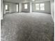 Spacious bonus room showcasing plush gray carpet, white walls, and multiple windows at 832 Spinney Ln, Whiteland, IN 46184
