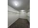 Walk-in closet features standard shelving and neutral carpet for optimal storage and organization at 832 Spinney Ln, Whiteland, IN 46184