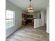 Open-concept kitchen and dining area with wood cabinets and access to living spaces at 832 Spinney Ln, Whiteland, IN 46184