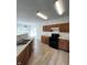 Well-equipped kitchen with wood cabinets, modern appliances, and plenty of counter space at 832 Spinney Ln, Whiteland, IN 46184