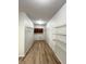 Laundry room features laminate floors, wire shelving, and a wooden storage cabinet at 832 Spinney Ln, Whiteland, IN 46184