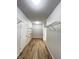 Spacious walk-in closet featuring wire shelving and laminate wood flooring at 832 Spinney Ln, Whiteland, IN 46184