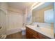 Bathroom showcasing a shower-tub combination and wood-finish sink vanity, providing a functional space at 8410 Hague Rd # 5, Indianapolis, IN 46256