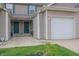 Charming townhouse exterior with a one-car garage and well-maintained landscaping at 8410 Hague Rd # 5, Indianapolis, IN 46256