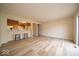 A large open concept living space featuring wood look floors and an eat-in kitchen area at 8410 Hague Rd # 5, Indianapolis, IN 46256