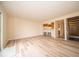 Spacious living room featuring wood-look floors, neutral walls, and stairs to the second floor at 8410 Hague Rd # 5, Indianapolis, IN 46256