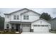 Charming two-story home featuring a two-car garage, white siding, and a welcoming front porch at 864 Cowley Dr, Westfield, IN 46074