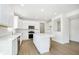Spacious kitchen with white cabinetry, stainless appliances, and a large island, creating an open layout at 864 Cowley Dr, Westfield, IN 46074