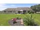 Lush backyard with patio, charming fence, and meticulously landscaped garden beds at 10934 Harness Ct, Indianapolis, IN 46239