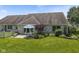 Brick home with a well-maintained backyard and patio area, ideal for outdoor relaxation and entertaining guests at 10934 Harness Ct, Indianapolis, IN 46239