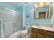 Bathroom features a shower and bath combination, plus a vanity mirror and cabinet at 10934 Harness Ct, Indianapolis, IN 46239