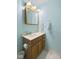 Bathroom featuring a light blue painted wall, and a framed vanity mirror at 10934 Harness Ct, Indianapolis, IN 46239