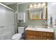 Bathroom with a walk-in shower, vanity with cabinets, and neutral decor at 10934 Harness Ct, Indianapolis, IN 46239