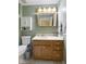 Bathroom featuring a vanity with cabinets and drawers for storage, plus a walk-in shower at 10934 Harness Ct, Indianapolis, IN 46239