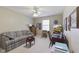 Versatile bedroom with a sofa, desk area, and ceiling fan, suitable for a home office at 10934 Harness Ct, Indianapolis, IN 46239