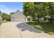 Charming home with a brick facade, an attached garage, and a well maintained front yard at 10934 Harness Ct, Indianapolis, IN 46239