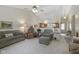 Spacious living room with plush seating, lots of natural light, and seamless open floor plan at 10934 Harness Ct, Indianapolis, IN 46239