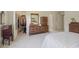 Main bedroom with walk-in closet, neutral carpet, and modern dresser at 10934 Harness Ct, Indianapolis, IN 46239