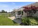 A cozy patio features a table, chairs, and an umbrella, offering a comfortable outdoor seating area at 10934 Harness Ct, Indianapolis, IN 46239