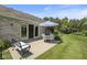 Outdoor patio with table and chairs, perfect for relaxation and enjoying the tranquil backyard setting at 10934 Harness Ct, Indianapolis, IN 46239