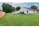 Expansive backyard featuring a lush lawn, wooden deck, perfect for outdoor enjoyment and entertainment at 10973 Freeman Ct, Indianapolis, IN 46234