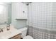 Cozy bathroom featuring a vanity with storage, toilet, and a shower with a patterned curtain at 10973 Freeman Ct, Indianapolis, IN 46234