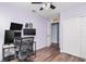 Charming bedroom with a ceiling fan, light purple walls, and a wooden floor, creating a comfortable atmosphere at 10973 Freeman Ct, Indianapolis, IN 46234