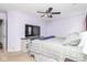 Cozy bedroom featuring a ceiling fan, TV, and a comfortable bed at 10973 Freeman Ct, Indianapolis, IN 46234