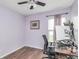 Cozy bedroom featuring light purple walls, complemented by modern furnishings and a window for natural light at 10973 Freeman Ct, Indianapolis, IN 46234