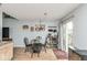 Dining area with a view to the backyard and decorative wine rack and adjacent to the kitchen at 10973 Freeman Ct, Indianapolis, IN 46234