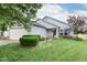 Charming single-story home with a well-manicured lawn and attached two-car garage at 10973 Freeman Ct, Indianapolis, IN 46234
