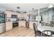 Functional kitchen with stainless steel appliances, light wood cabinets and open to the living area at 10973 Freeman Ct, Indianapolis, IN 46234