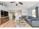 Open-concept living room with views of the kitchen and comfortable sectional seating at 10973 Freeman Ct, Indianapolis, IN 46234