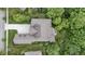 An aerial view showcases the home's layout, driveway, roof, and surrounding greenery at 11393 Muirfield Trce, Fishers, IN 46037
