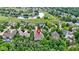 Great aerial view of the property's location within a golf course community and its proximity to a scenic pond at 11393 Muirfield Trce, Fishers, IN 46037