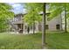 The home has a patio with a fire pit and comfortable seating in the backyard at 11393 Muirfield Trce, Fishers, IN 46037