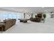 Finished basement with a pool table, media area, and large windows for natural light at 11393 Muirfield Trce, Fishers, IN 46037