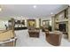 Finished basement with a fireplace, seating area, kitchenette, and pool table for entertainment at 11393 Muirfield Trce, Fishers, IN 46037