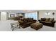 Spacious finished basement area with comfortable seating, accent tables, and neutral carpet at 11393 Muirfield Trce, Fishers, IN 46037