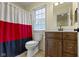 Bathroom featuring vanity with dark wood cabinets and white shower curtain at 11393 Muirfield Trce, Fishers, IN 46037