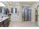 Well-appointed bathroom with a luxurious soaking tub, walk-in shower, and stylish vanity at 11393 Muirfield Trce, Fishers, IN 46037