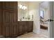 Bathroom with vanity and storage featuring a door to the bedroom at 11393 Muirfield Trce, Fishers, IN 46037