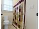 Cozy bathroom featuring a neutral color palette and a tiled floor at 11393 Muirfield Trce, Fishers, IN 46037