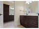 Bathroom featuring dark wood cabinets, and a door to another room at 11393 Muirfield Trce, Fishers, IN 46037