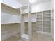 Spacious walk-in closet featuring custom shelving and ample storage for clothes and accessories at 11393 Muirfield Trce, Fishers, IN 46037