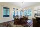 Bright dining area with a wooden table, chairs, and view of backyard at 11393 Muirfield Trce, Fishers, IN 46037