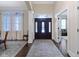 Welcoming foyer featuring hardwood floors and an elegant rug at 11393 Muirfield Trce, Fishers, IN 46037