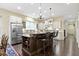 Kitchen with granite island with breakfast bar and stainless steel refrigerator at 11393 Muirfield Trce, Fishers, IN 46037