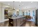 Spacious kitchen with a large island, granite countertops and adjoining dining area at 11393 Muirfield Trce, Fishers, IN 46037