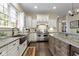 Gourmet kitchen with a farmhouse sink, stainless steel range, and ample counter space at 11393 Muirfield Trce, Fishers, IN 46037